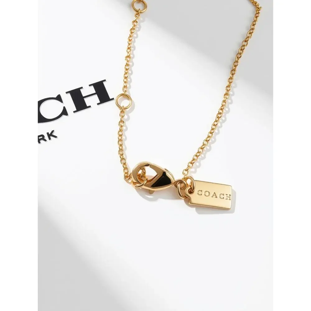 Coach Quilted Monogram Padlock & Key gold-tone necklace